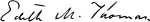 Thomas's signature, slanted leftward, reading "Edith M. Thomas."