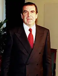 Image 69Double breasted power suit with large shoulder pads worn in the European workplace, 1998 (from 1990s in fashion)
