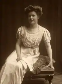 Sepia image of a woman sitting on a chair