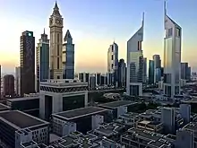 Image 7A view of the Emirates Towers in Dubai. The towers are the tallest two buildings on the right.