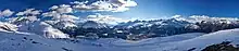 Panorama of the Upper Engadine Valley from Muottas Muragl, showing peaks Piz Muragl, Piz Julier and Piz Ot, as well as St. Moritz town and Celerina.