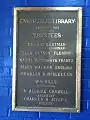 Plaque from 1910 details the architects, trustees of the library.