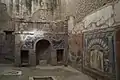 House Number 22 is noted for this outstanding summer triclinium with a nymphaeum decorated with coloured mosaics.