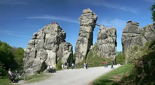 Image 17ExternsteinePhoto credit: Daniel SchwenThe Externsteine, a distinctive rock formation located in the Teutoburger Wald region of northwestern Germany, are a popular tourist attraction. Stairs and a small bridge connecting two of the rocks lead to the top.