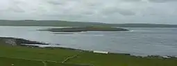 Eynhallow viewed from Rousay, from the north-east, with the Orkney Mainland beyond