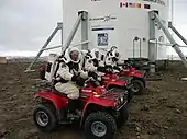 Robert Zubrin, Vladimir Pletser, and Katy Quinn of Crew 2 prepare to begin a motorized EVA on July 15, 2001.