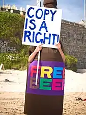 A mascot dressed as "FREE BEER version "St Austell" 3.2", demonstrates for the right to share and copy (2007)