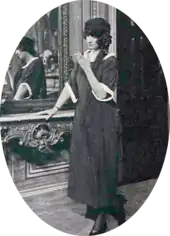 Young white woman in mourning clothes, smoking a cigarette