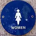 Non-AIGA women's symbol on a legally mandated circular background in USA