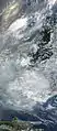 The lowlands to the north-west and south-east are shrouded with thick, grey smoke from dozens of fires in this satellite image from 2009.