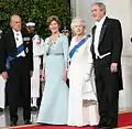 President George W. Bush and First Lady Laura Bush with Queen Elizabeth II and Prince Philip, Duke of Edinburgh at the beginning of an official dinner at the White House, 2007.