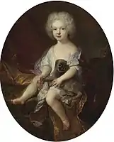 Portrait of a young boy with a dog