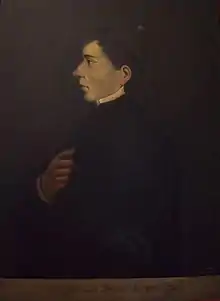 Left-facing profile portrait of Mier in priestly attire. He is depicted with black hair, brown eyes and a pointed nose.