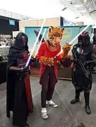 A leopard fursuiter with multiple Star Wars characters.