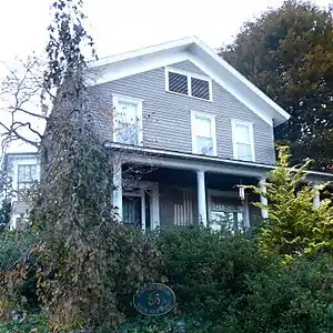 The former wraparound porch on the right hand side has been removed