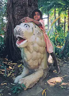 Image 22A girl in Udaipur playing "Jungle Child" (from Girls' toys and games)