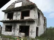 Croatian house defaced with graffiti: Serbian cross, "Red Star champion", "Usraše se Ustaše" (Ustashas shat their pants) and "God protects Serbs"