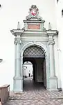 Main gates of the Palace of the Grand Dukes of Lithuania with a portal featuring Vytis in Vilnius