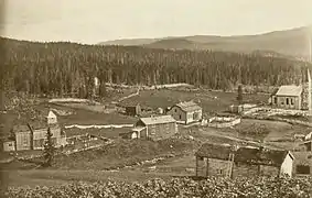 Hattfjelldal Church (1868) under construction (right hand), old church left hand.