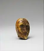 Head; 2nd–4th century; ivory (walrus); height: 6.35 cm (2.mw-parser-output .frac{white-space:nowrap}.mw-parser-output .frac .num,.mw-parser-output .frac .den{font-size:80%;line-height:0;vertical-align:super}.mw-parser-output .frac .den{vertical-align:sub}.mw-parser-output .sr-only{border:0;clip:rect(0,0,0,0);clip-path:polygon(0px 0px,0px 0px,0px 0px);height:1px;margin:-1px;overflow:hidden;padding:0;position:absolute;width:1px}1⁄2 in.); Metropolitan Museum of Art