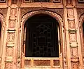 The mohallah is known for the intricate wood-carvings that decorate its homes.