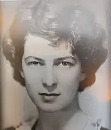 "Black and white photograph of Helen Hooker, showing a woman aged around 30 with thick wavy hair of shoulder length"