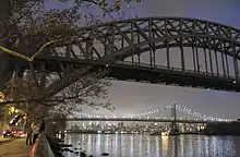 The Hell Gate Bridge and Triborough Bridge as seen from the park's waterfront at night
