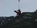 HFRS technician landing with the aerial rescue platform.