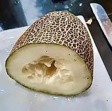A varietal grown by the Hmong people with textured skin and large seeds