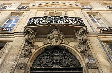 Rococo mascaron above the door of the Hôtel de Chenizot (Rue Saint-Louis-en-l'Île no. 51-53), Paris, by Pierre Vigné de Vigny, 1719