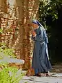 The religious habit of the Franciscan Friars and Sisters of the Immaculate is gray-blue. (The image shown is, however, from an un-related Community)