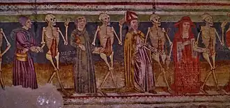 A mural depicting a cardinal, a bishop, a monk and a peasant dancing with skeletons