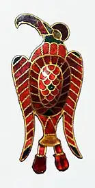 A saddle fitting artifact representing a bird of prey