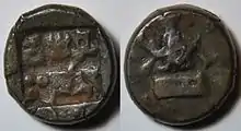 A bronze currency of .mw-parser-output .frac{white-space:nowrap}.mw-parser-output .frac .num,.mw-parser-output .frac .den{font-size:80%;line-height:0;vertical-align:super}.mw-parser-output .frac .den{vertical-align:sub}.mw-parser-output .sr-only{border:0;clip:rect(0,0,0,0);clip-path:polygon(0px 0px,0px 0px,0px 0px);height:1px;margin:-1px;overflow:hidden;padding:0;position:absolute;width:1px}1⁄2 karshapana of King Indramitra (ca 75-50 BC?) Of Ahichatra of Panchala. Obv: A inside a rectangle, a line of 3 symbols, under the name of the king. Rev: Indra standing on a pedestal without pillars. Dimensions: 15&nbsp;mm. Weight: 4.18 g.