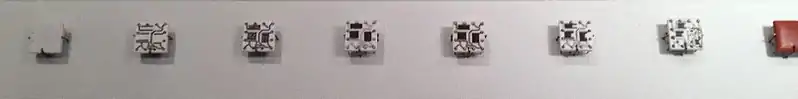 Steps in manufacturing Solid Logic Technology hybrid modules. The process starts with a blank ceramic wafer, .mw-parser-output .frac{white-space:nowrap}.mw-parser-output .frac .num,.mw-parser-output .frac .den{font-size:80%;line-height:0;vertical-align:super}.mw-parser-output .frac .den{vertical-align:sub}.mw-parser-output .sr-only{border:0;clip:rect(0,0,0,0);clip-path:polygon(0px 0px,0px 0px,0px 0px);height:1px;margin:-1px;overflow:hidden;padding:0;position:absolute;width:1px}1⁄2 inch (13&nbsp;mm) square. Circuits are laid down first, followed by resistive material. Pins are added, the circuits are soldered and the resistors trimmed to the desired value. Then individual transistors and diodes are added and the package is encapsulated.
