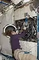 Sandra Magnus as she works with the Combustion Integrated Rack (CIR) in the U.S. Laboratory, Destiny, during maintenance.