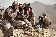 A field radio operator with 9th Communications Battalion, participating in WTI 2-13, uses a laser target designator at the Chocolate Mountain Aerial Gunnery Range (2013)