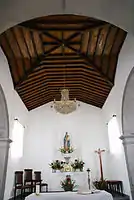 The wood vaulted ceiling in the apse