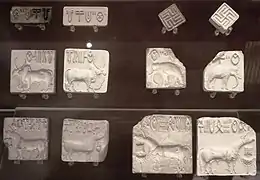 Seals with Indus script and impressions; 2500-2000 BC; steatite; various sizes, mostly c.3 cm; British Museum (London)