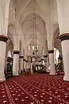 The carpet pattern marks the ranks for the faithful to pray towards Mecca (obliquely on the right) in the Selimiye Mosque of Northern Nicosia.