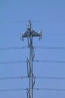 An antenna array atop an electricity pylon
