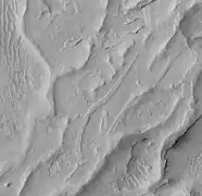 Inverted channels in Aeolis quadrangle.  It is believed that stream channels became raised features after coarse materials were deposited and cemented.