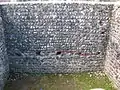 The red ribbon separates the original Roman tower wall from the restored wall