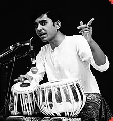 Ghosh reciting some Bols and playing the Tabla