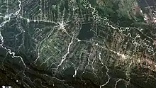 Image 4Satellite view of coca leaf and tropical fruit plantations in the Ivirgazama region of Bolivia. Several tropical areas in the country have experienced major deforestation.  (from Economy of Bolivia)
