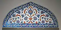 Iznik tiled lunette panel that may have come from the Piyale Pasha Mosque in Istanbul, 1570-1575, in the Victoria and Albert Museum from London