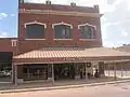J. Cruse Christmas Gallery downtown; behind the gallery is the OS Museum, developed by Giles McCrary.