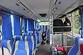 Interior of a JA Connexion bus with bag racks equipped