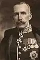 Olivier without a beard but with military decorations.