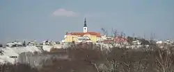 St. Urban's Church in Destrnik. The yellow buildings and the rest of the foreground is in the settlement of Janežovski Vrh.